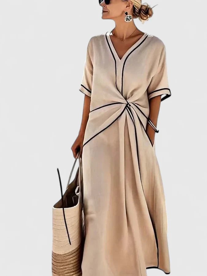 Cream maxi dress with contrast trim, V-neckline, and gathered front detail
