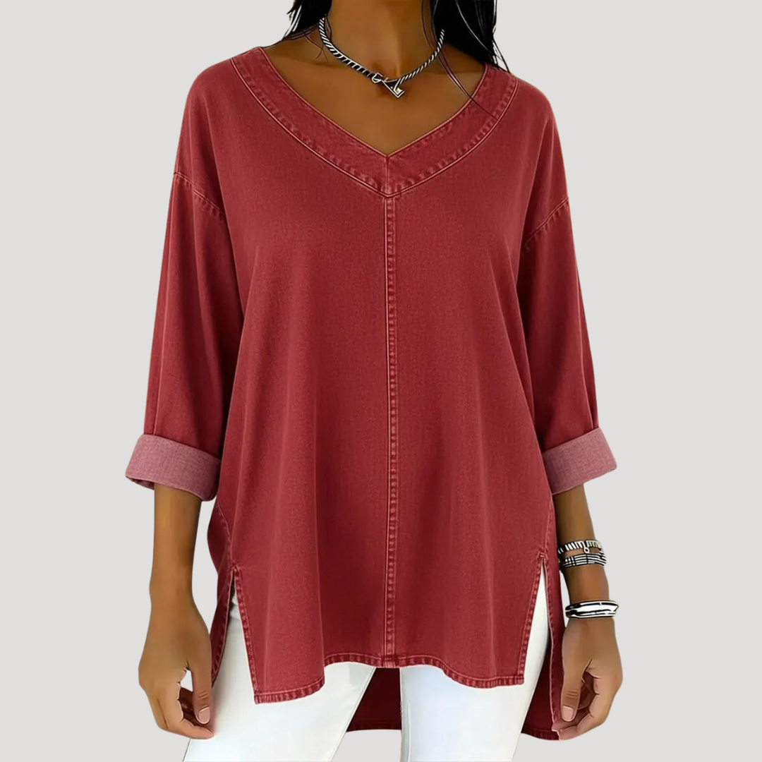 Rust red V-neck tunic top with rolled sleeves and side vents
