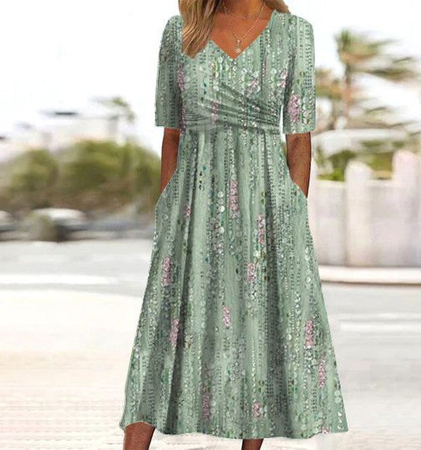Sage green floral midi dress with V-neck and ruched empire waist