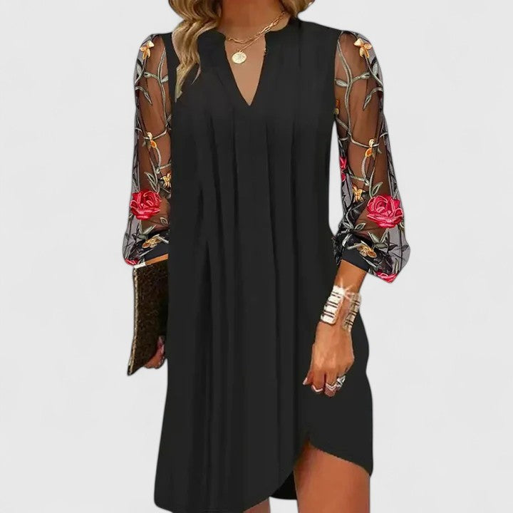 Black tunic dress with sheer floral embroidered sleeves and V-neck
