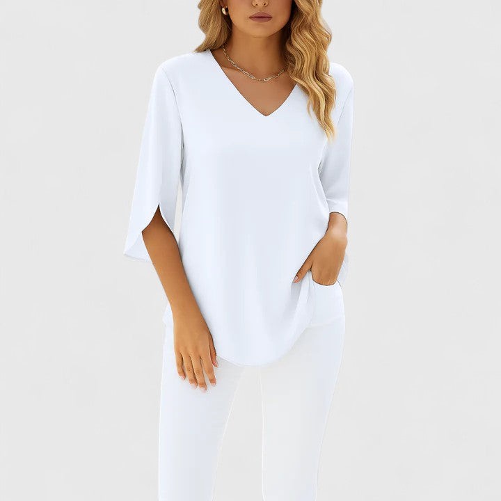 White V-neck blouse featuring split sleeves and a relaxed curved hem