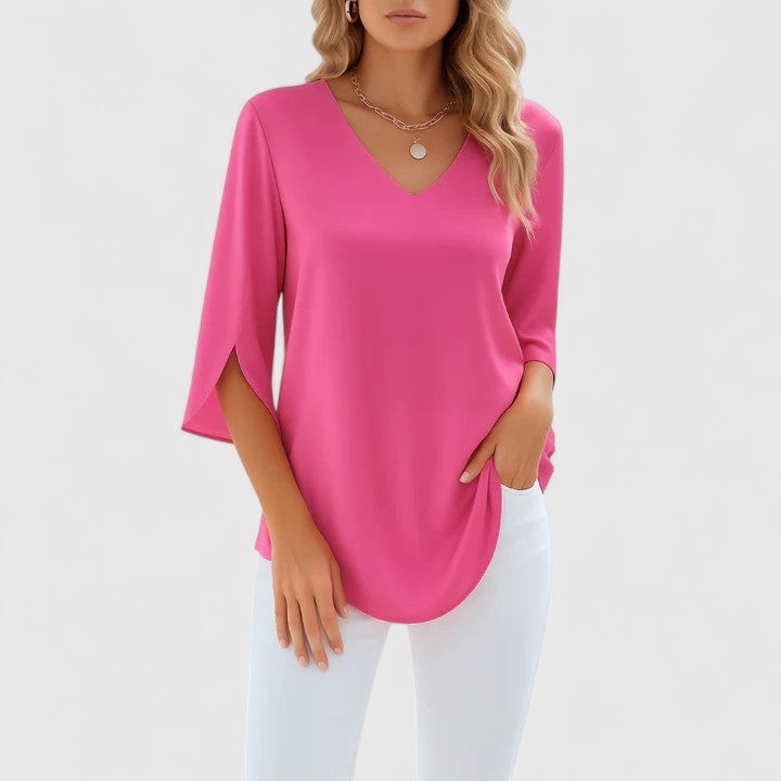 Hot pink V-neck blouse with split sleeves and curved hemline