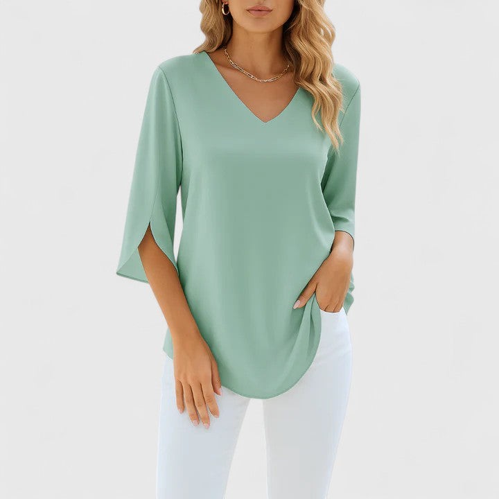 Sage green V-neck blouse featuring split sleeves and soft draped fit