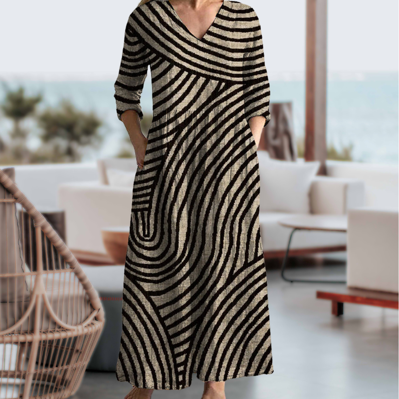 Black and beige wave-striped maxi dress with pockets, outdoor setting