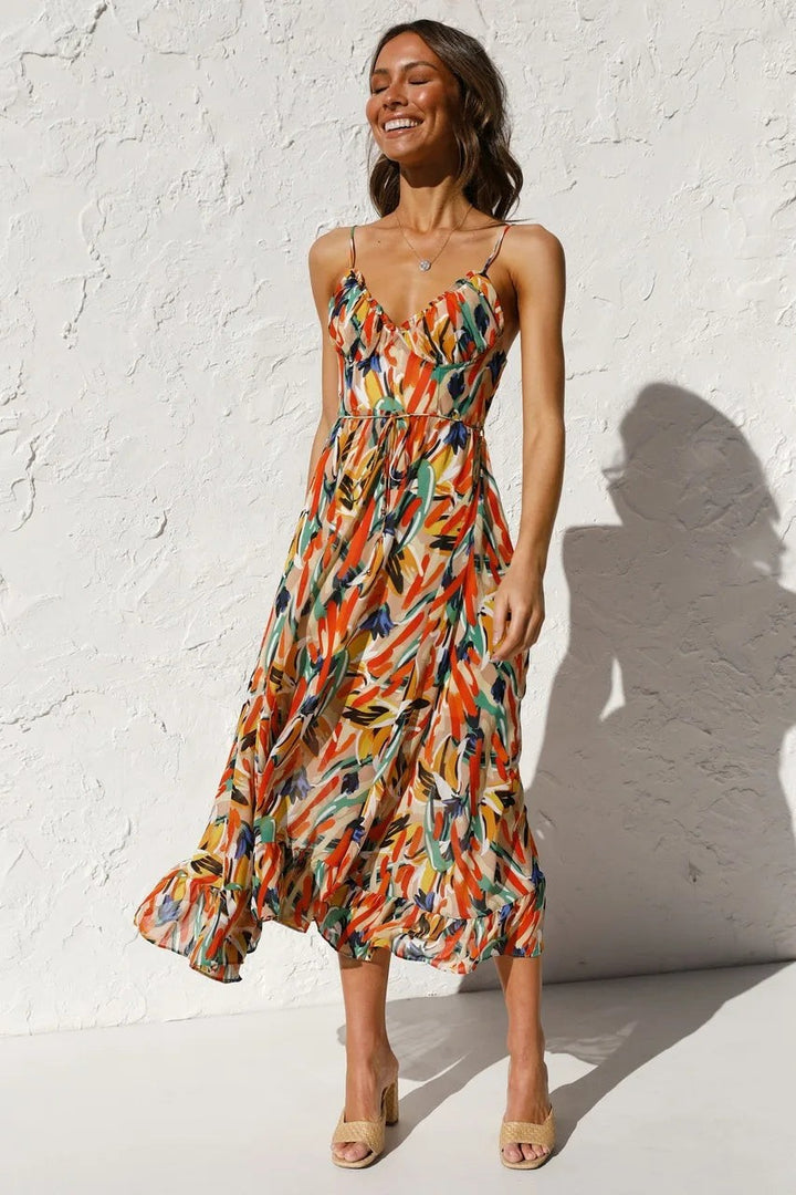 Abstract print midi dress with V-neckline and spaghetti straps, worn front view