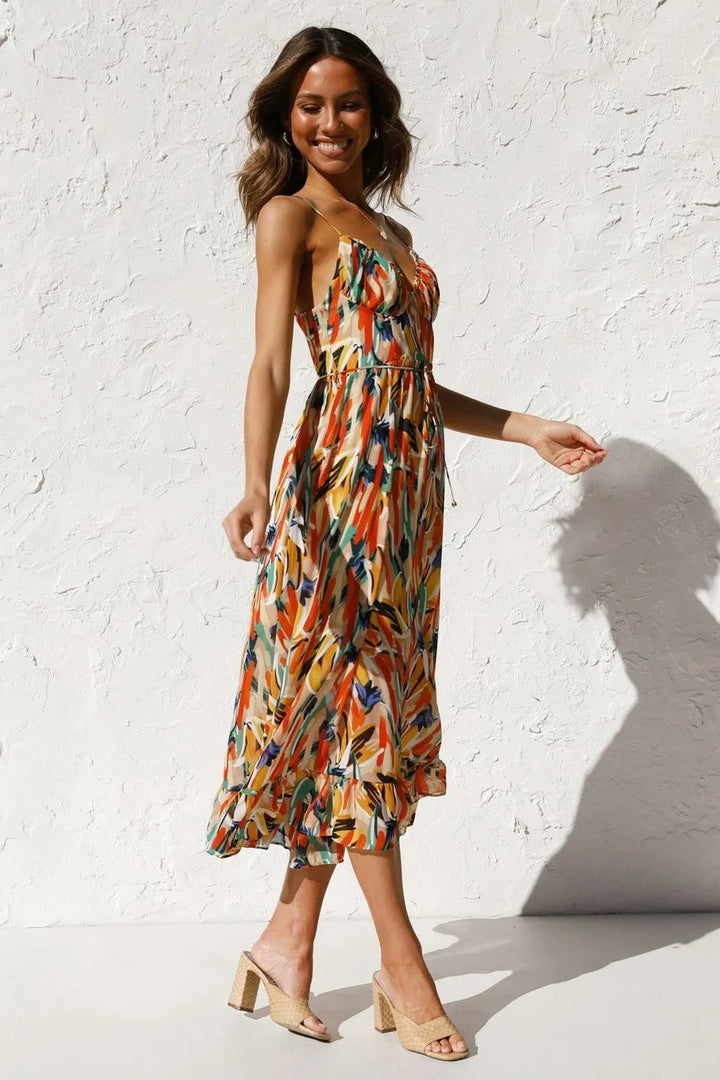 Sweetheart neckline midi dress in vibrant abstract print, side profile