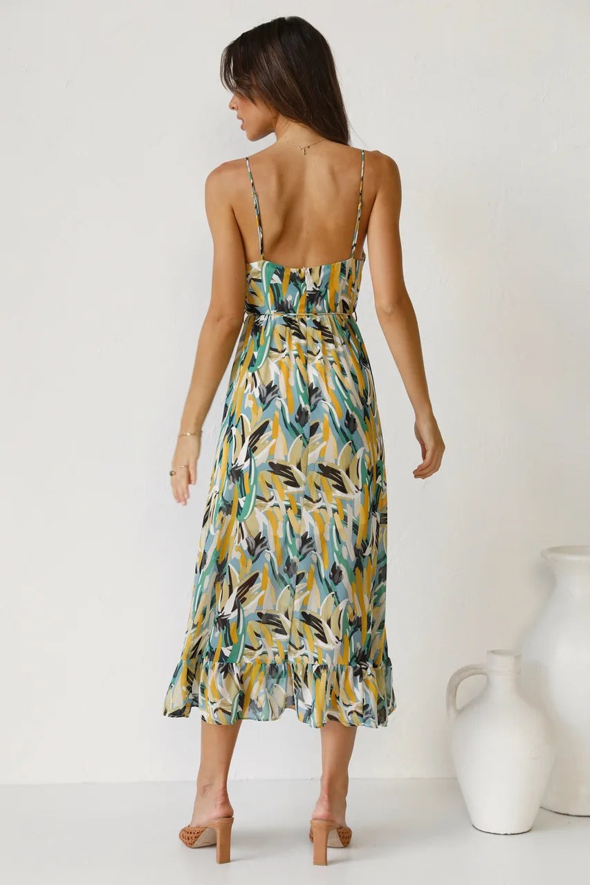 Backless design shown on printed midi dress with thin straps