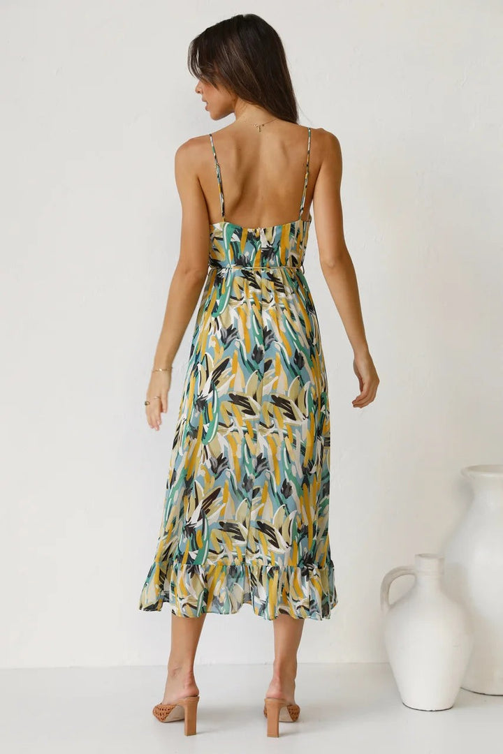 Backless design shown on printed midi dress with thin straps