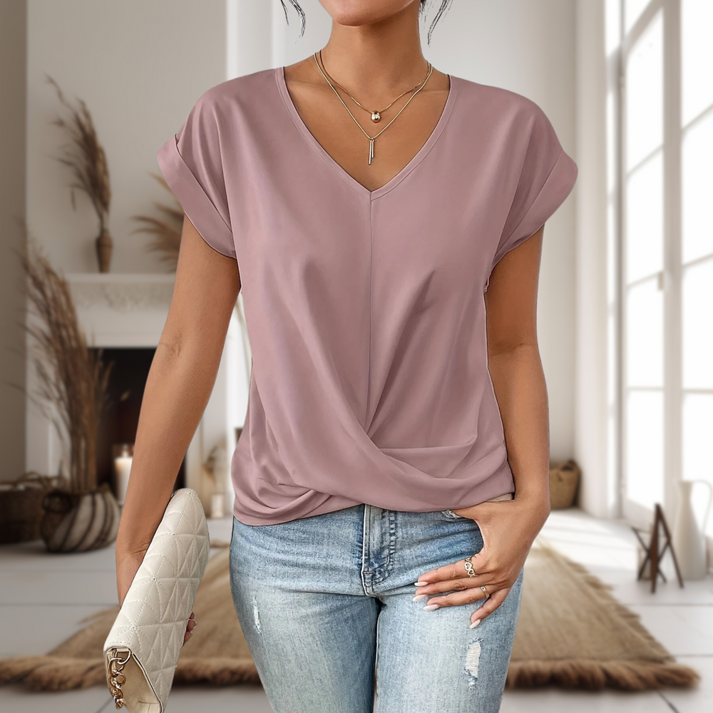 Dusty pink V-neck top featuring draped twist-front hem design