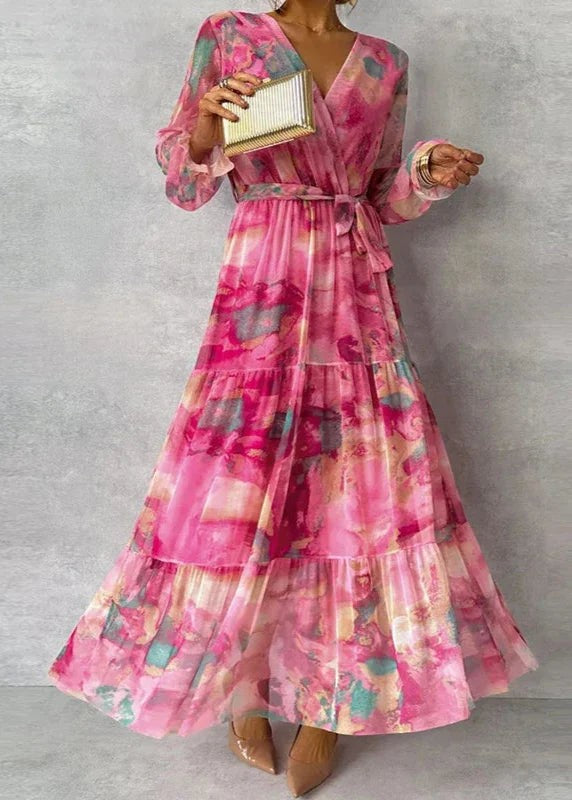 Pink tie-dye wrap maxi dress with tiered skirt and long sleeves