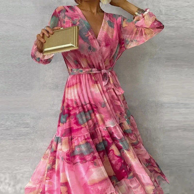 V-neck floral maxi dress featuring belted waist and billowy sleeves