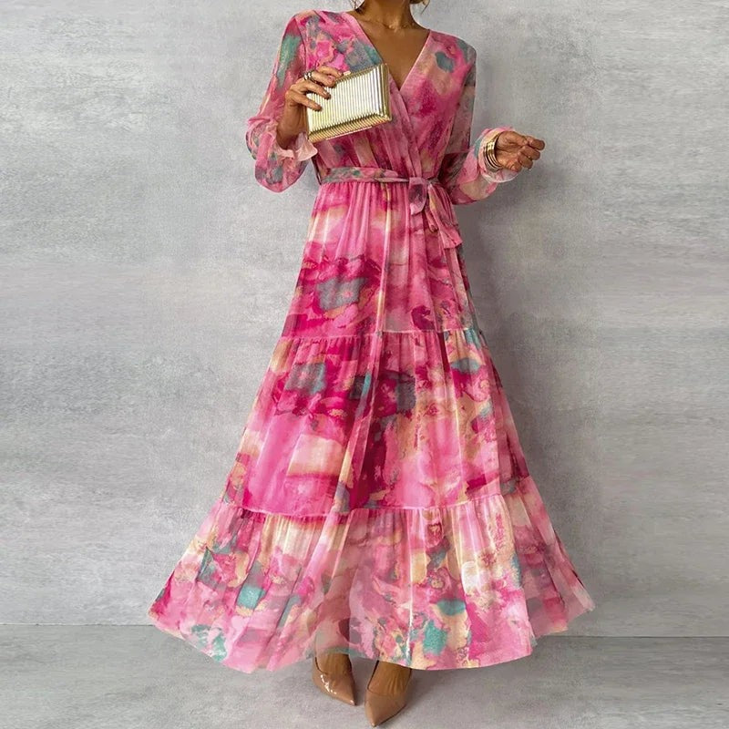 Bohemian wrap-style maxi dress in pink floral print with cinched waist