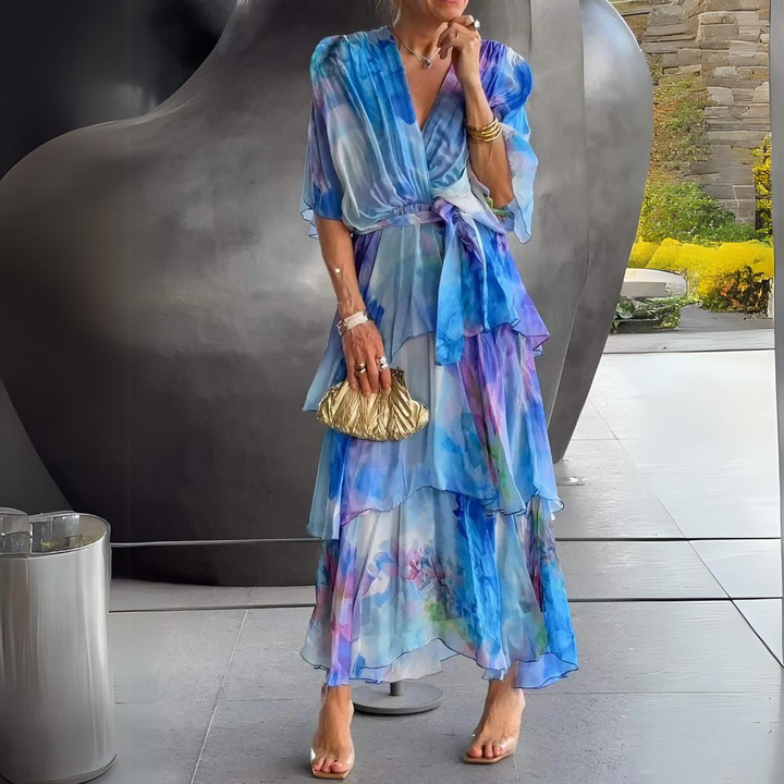 Blue watercolor floral tiered maxi dress with V-neck and flutter sleeves