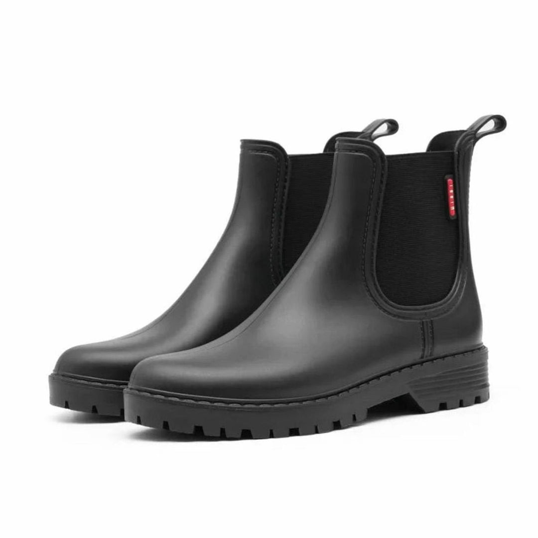 Black waterproof Chelsea boots with elastic side panels and chunky ridged sole
