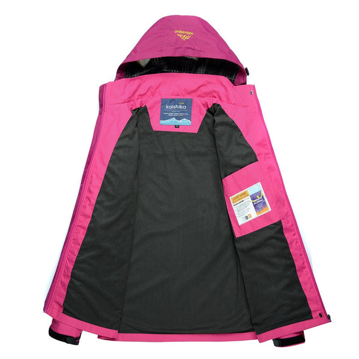 Interior view showing gray lining and pockets of pink hooded shell jacket