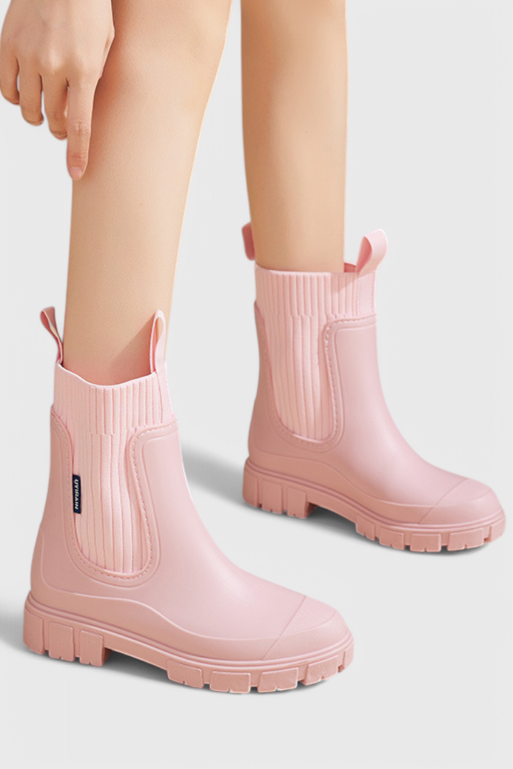 model wearing blush pink waterproof Chelsea boots outdoors style