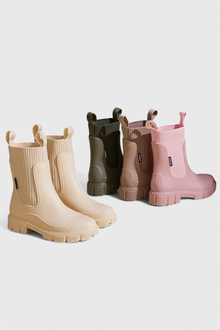 cream, olive, taupe, and pink Chelsea rain boots lined up together