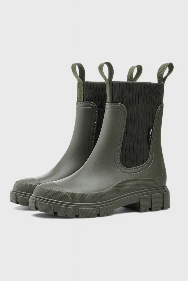 olive green Chelsea rain boots featuring ribbed knit cuff detail