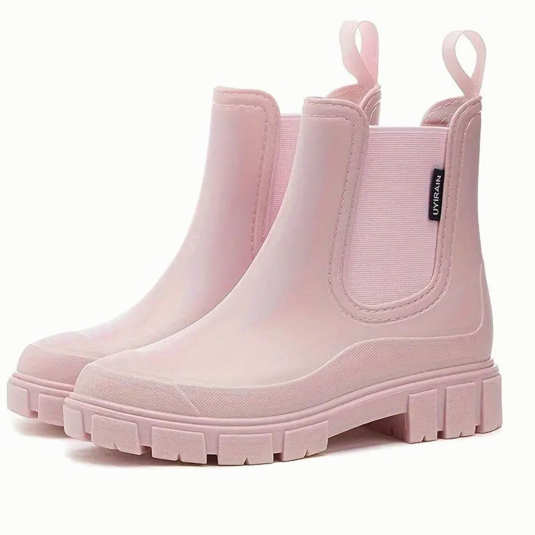 Pale pink waterproof Chelsea boots with elasticated gusset and lug sole