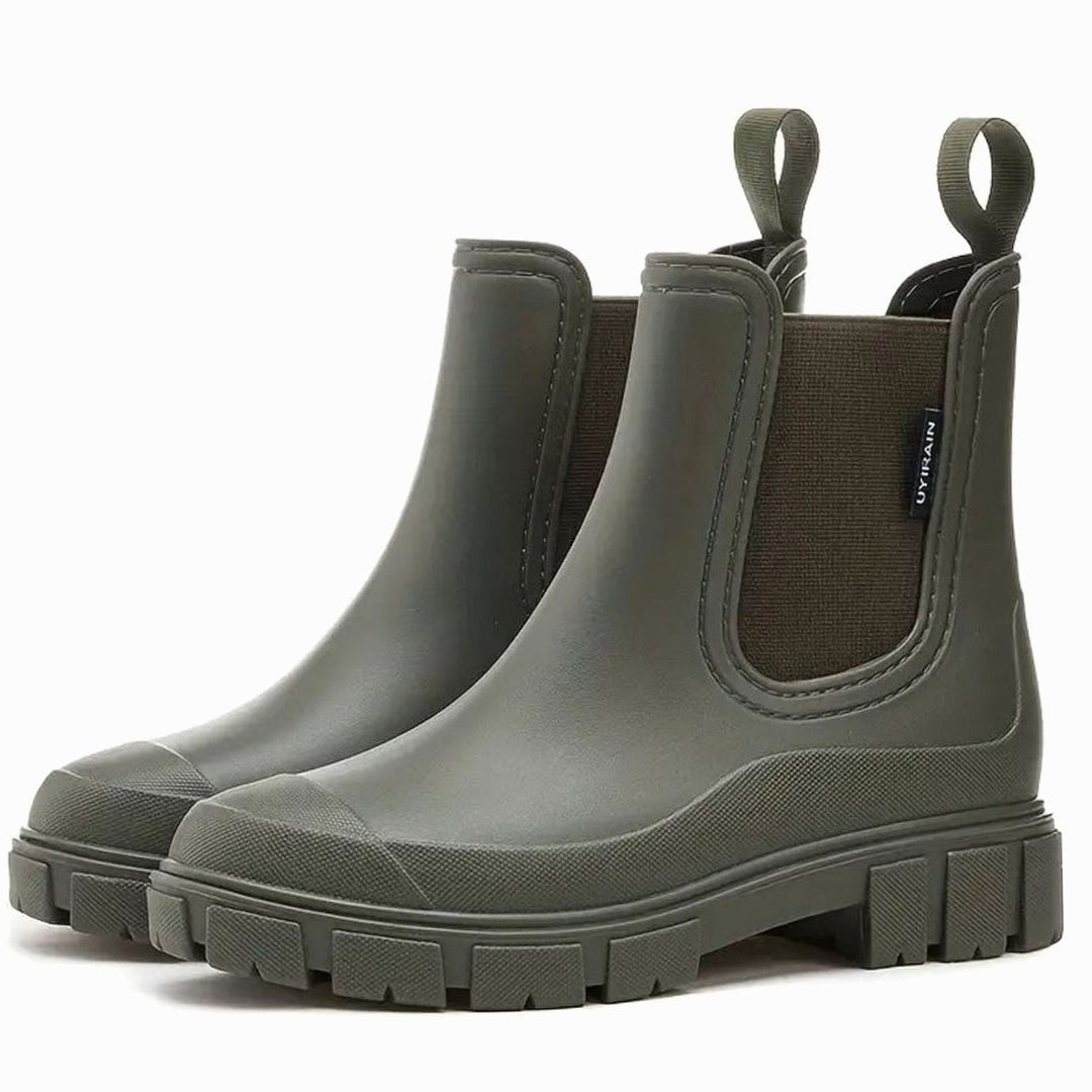 Khaki green Chelsea rain boots with chunky tread and pull loops