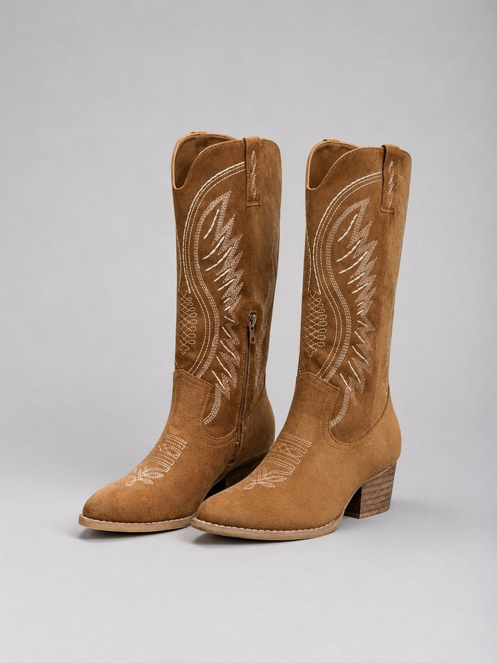 Tan suede cowboy boots with contrast stitching and block heel