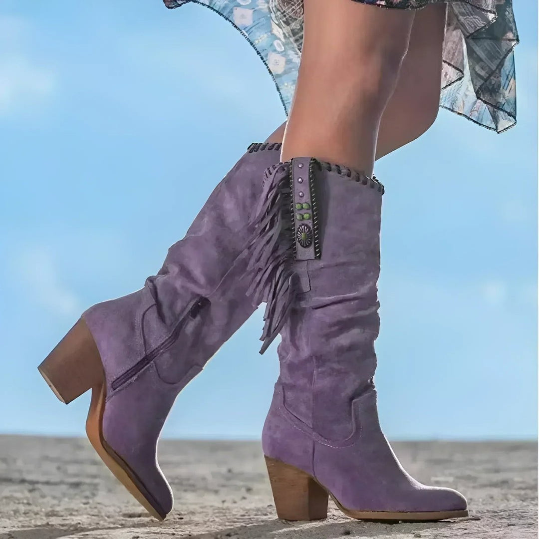 Lilac suede knee-high cowboy boots featuring fringe and block heel