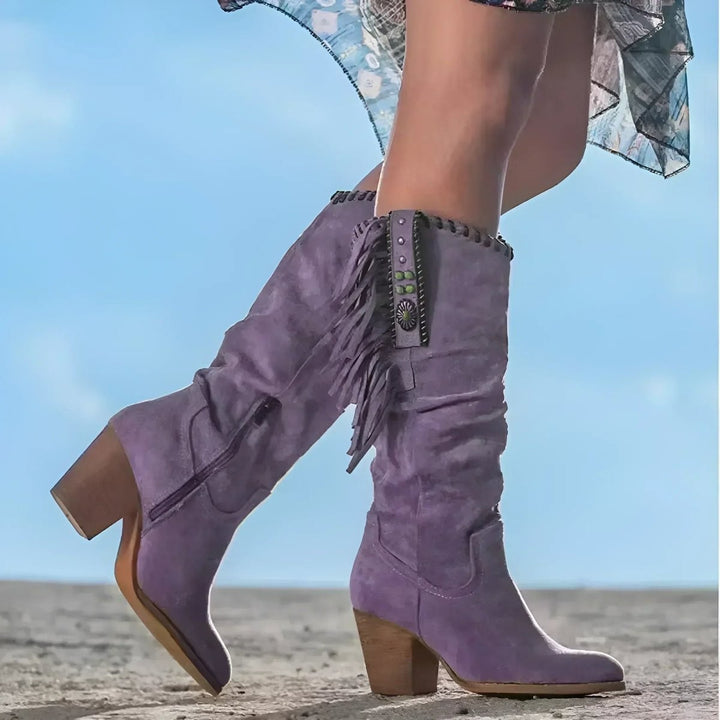 Lilac suede knee-high cowboy boots featuring fringe and block heel