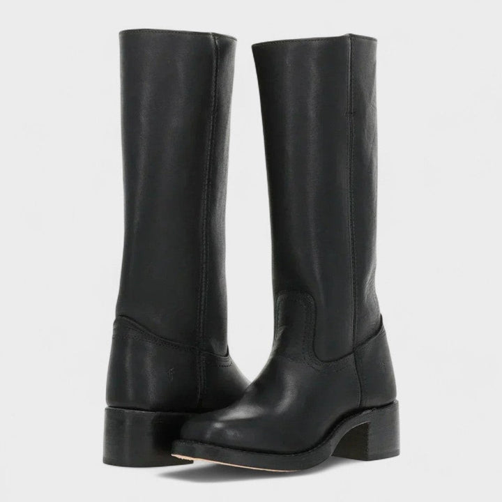 Black leather knee-high western boots featuring a sturdy block heel