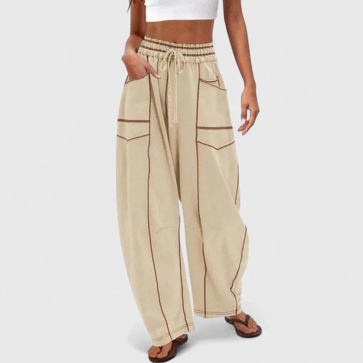 beige cargo pants with contrast stitching and wide-leg silhouette