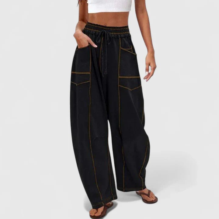 black wide-leg cargo pants with contrast stitching and drawstring waist