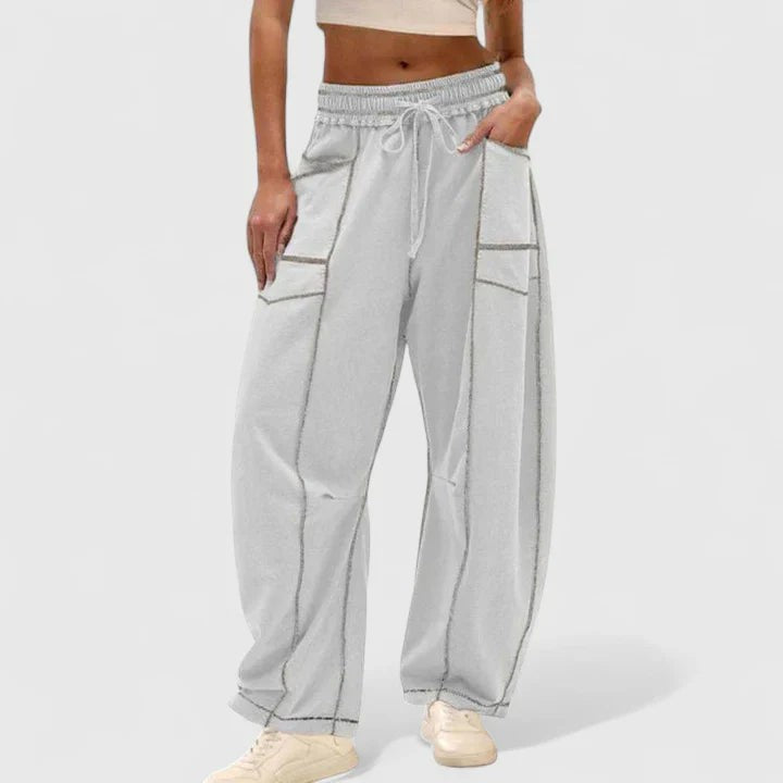 light gray wide-leg cargo pants with contrast stitching and pockets