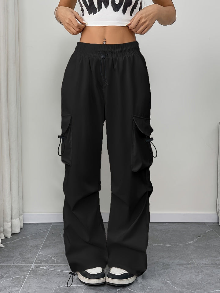 Black wide-leg cargo pants featuring drawstring waist and flap pockets
