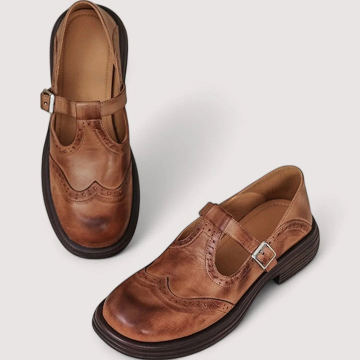 Cognac brown Mary Jane brogues with stacked heel and adjustable ankle strap