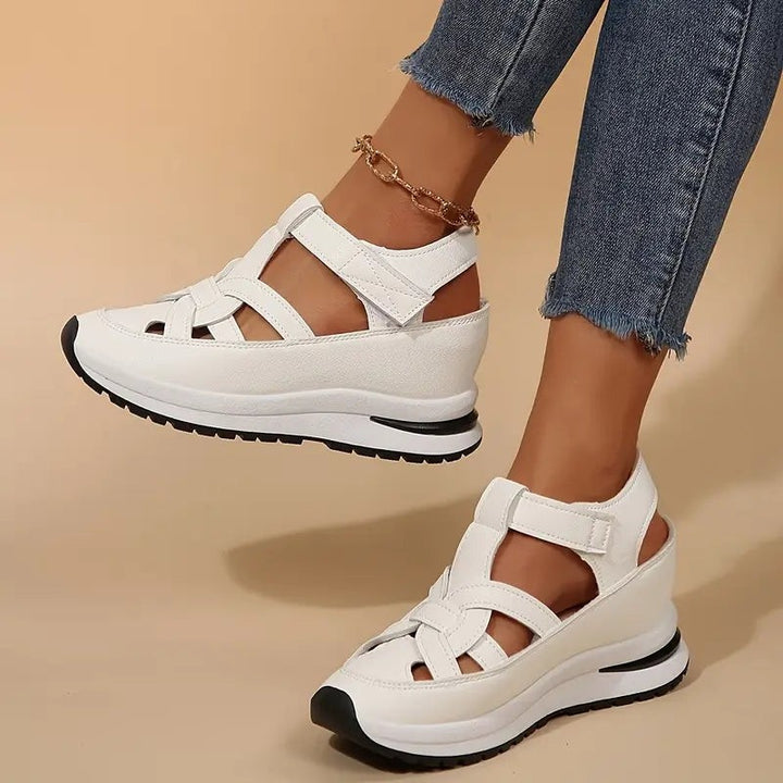 white gladiator-style platform sandals featuring woven straps and thick sole