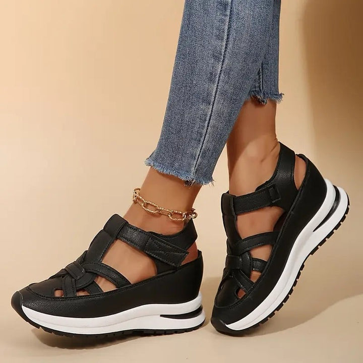 black platform sandals with strappy cutout design and hook-and-loop closure