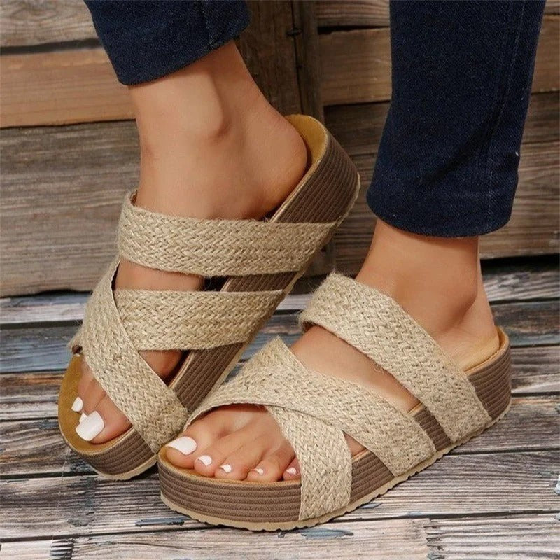 Tan braided crisscross platform sandals with woven straps and wedge footbed
