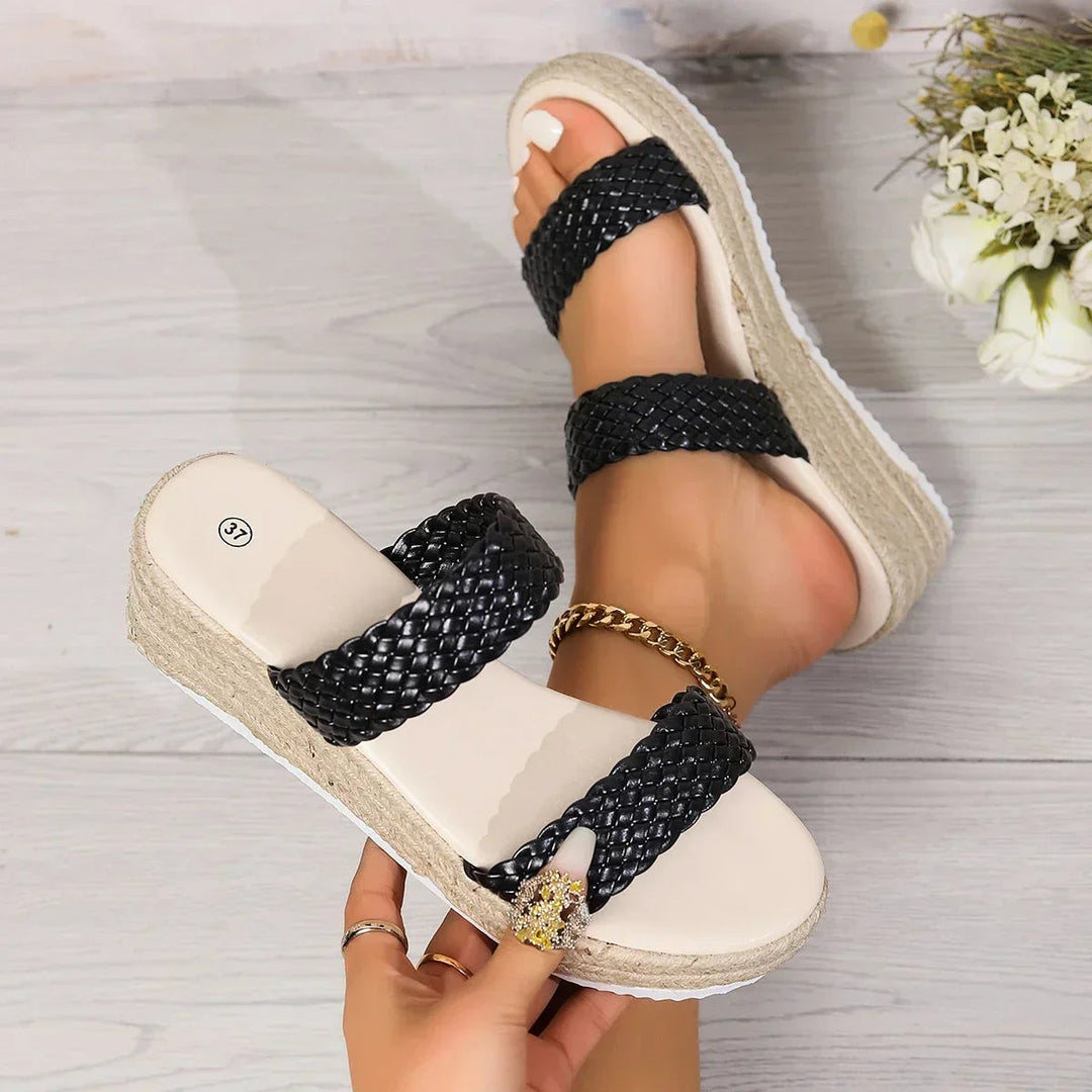 Top view of black woven platform wedge sandals with jute-wrapped sole