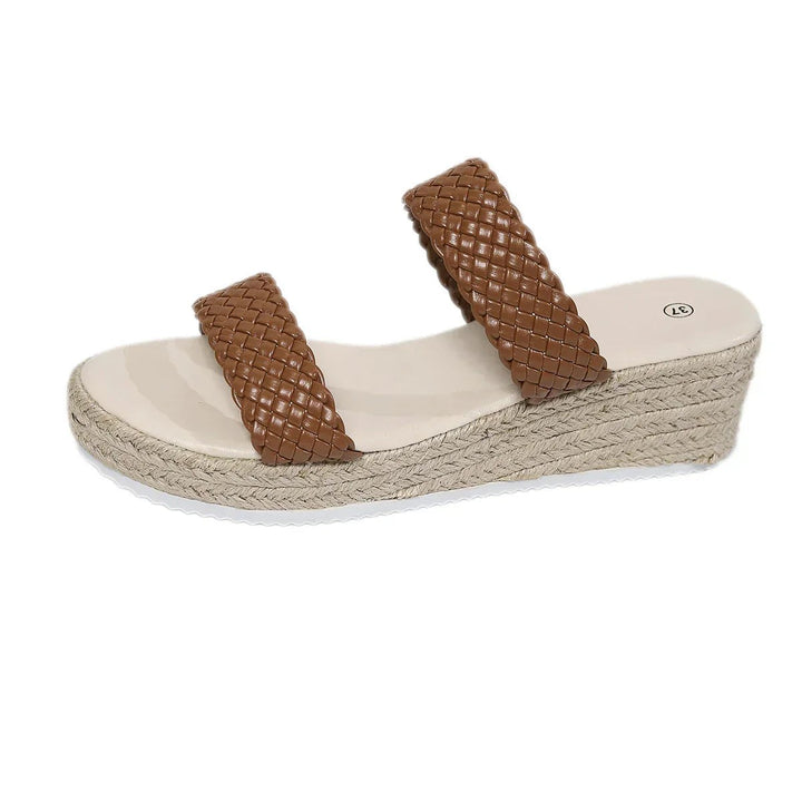 Side view of brown woven platform wedge sandal on white background