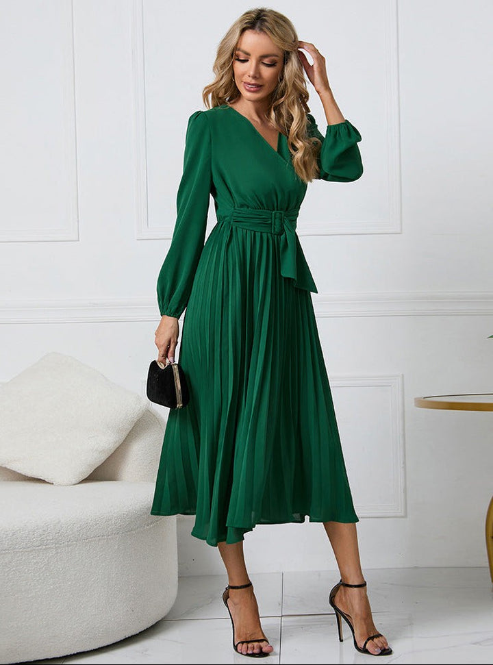 Green pleated midi dress with V-neck, long sleeves, and belted waist