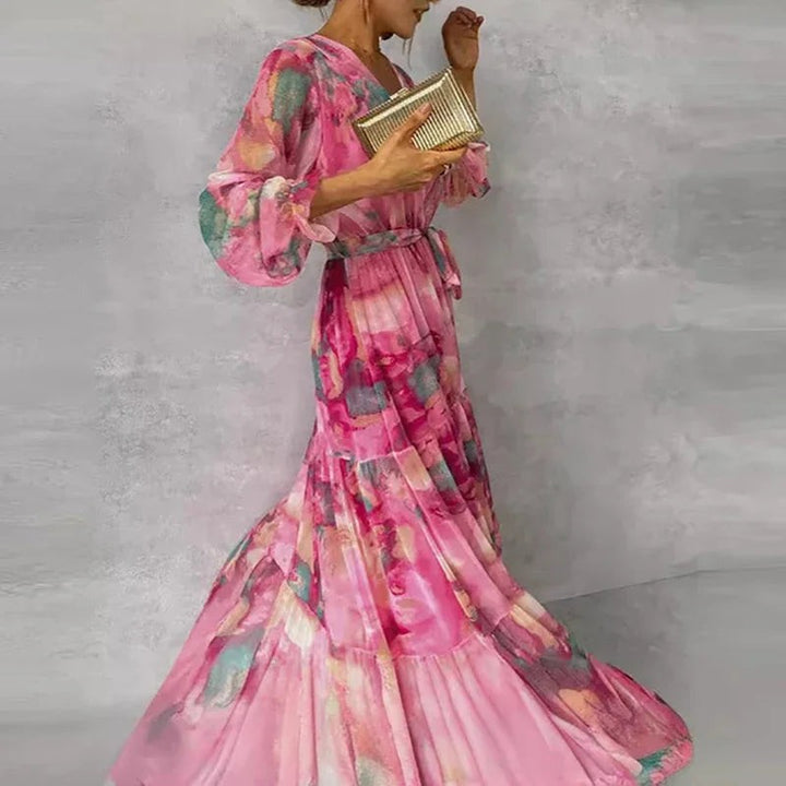 Side view of pink tiered maxi dress with billowy long sleeves