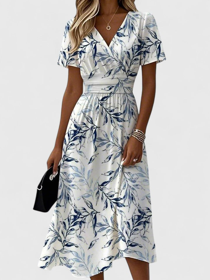 White wrap midi dress with blue leaf print and short flutter sleeves