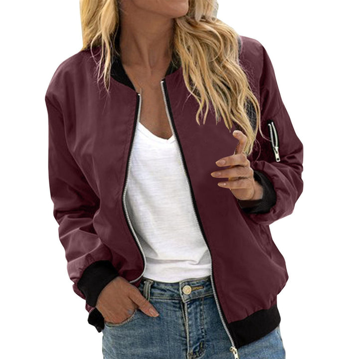 Burgundy zip-up bomber jacket with black ribbed accents and relaxed fit
